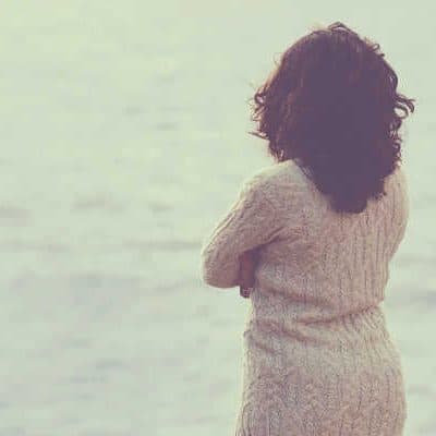 Woman starting out at the water